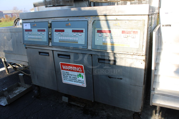 Henny Penny Model LVG-SSS Stainless Steel Commercial Floor Style Natural Gas Powered 3 Bay Deep Fat Fryer w/ 6 Metal Fry Baskets on Commercial Casters. 225,000 BTU. 47x32x48 - Image 4 of 8