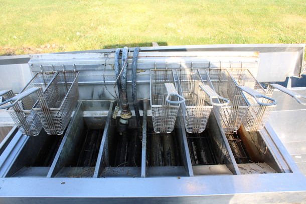 Henny Penny Model LVG-SSS Stainless Steel Commercial Floor Style Natural Gas Powered 3 Bay Deep Fat Fryer w/ 6 Metal Fry Baskets on Commercial Casters. 225,000 BTU. 47x32x48 - Image 8 of 8