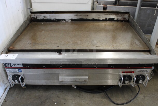APW Wyott Stainless Steel Commercial Countertop Propane Gas Powered Flat Top Griddle w/ Thermostatic Controls. 36x26x17
