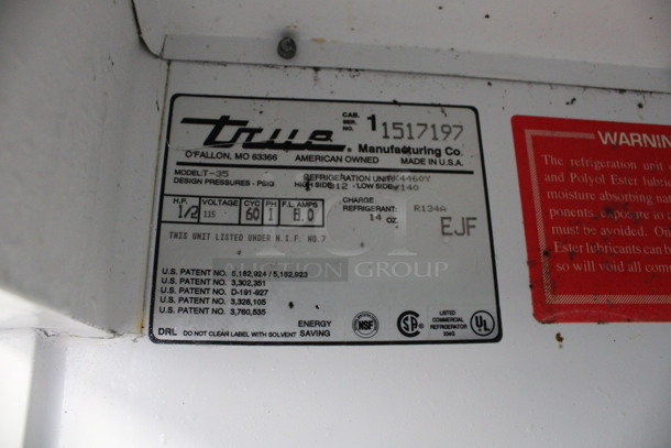 True Model T-35 Stainless Steel Commercial 2 Door Reach In Cooler w/ Poly Coated Racks on Commercial Casters. 115 Volts, 1 Phase. 39.5x30x83. Tested and Powers On But Temps at 46 Degrees - Image 4 of 6