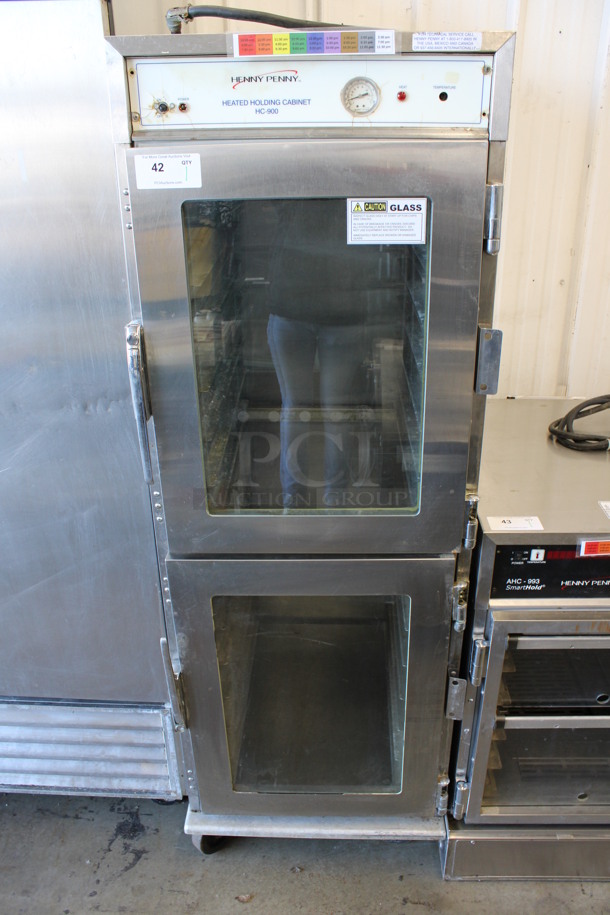 Henny Penny Model HC-900 Stainless Steel Commercial Heated Holding Cabinet on Commercial Casters. 120 Volts, 1 Phase. 24.5x31x71. Cannot Test Due To Plug Style
