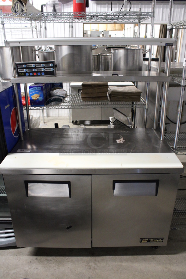 True Model TUC-48 Stainless Steel Commercial 2 Door Work Top Cooler w/ 2 Tier Over Shelf and Cutting Board on Commercial Casters. 115 Volts, 1 Phase. 48.5x30.5x67. Tested and Working!