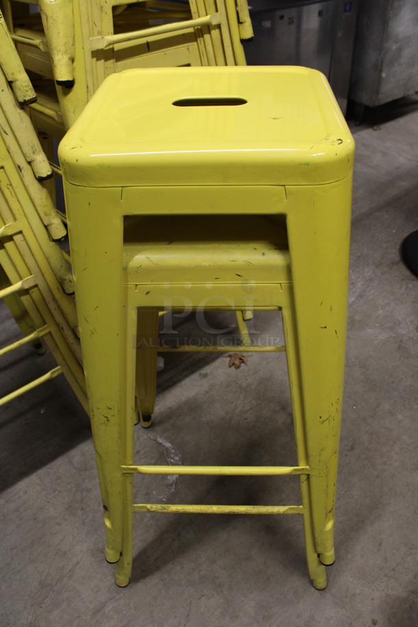 2 Yellow Metal Tolix Stools. Stock Picture - Cosmetic Condition May Vary. 17x17x30. 2 Times Your Bid!