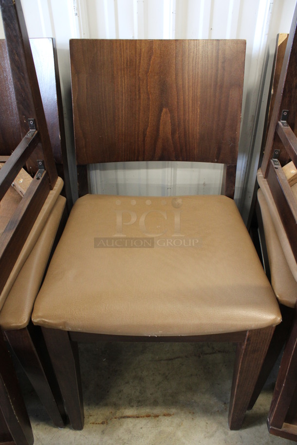 2 Wooden Dining Chairs w/ Tan Seat Cushion. Stock Picture - Cosmetic Condition May Vary. 18x20x34. 2 Times Your Bid!