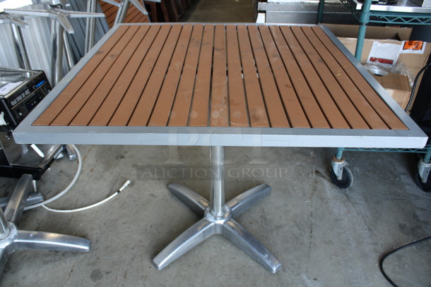 Outdoor Tabletop w/ Wood Pattern Planks and Metal Rim and Metal Table Base. Stock Picture - Cosmetic Condition May Vary. 35.5x35.5x29