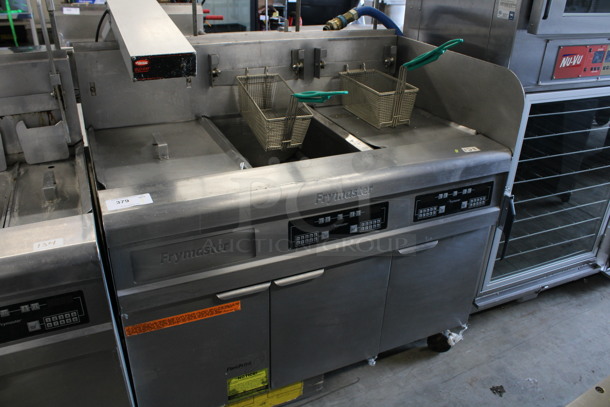 Frymaster Model FMPH255BLSC ENERGY STAR Stainless Steel Commercial Natural Gas Powered 2 Bay Fryer w/ Left Side Warming Dumping Station, Warming Strip and 2 Metal Fry Baskets on Commercial Casters. 47x36x50
