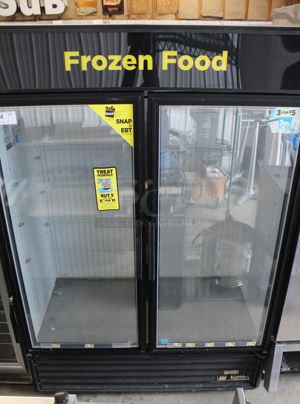 2012 True Model GDM-49F-LD ENERGY STAR Metal Commercial 2 Door Reach In Freezer Merchandiser w/ Poly Coated Racks. 115 Volts, 1 Phase. 54x30x78. Cannot Test Due To Plug Style
