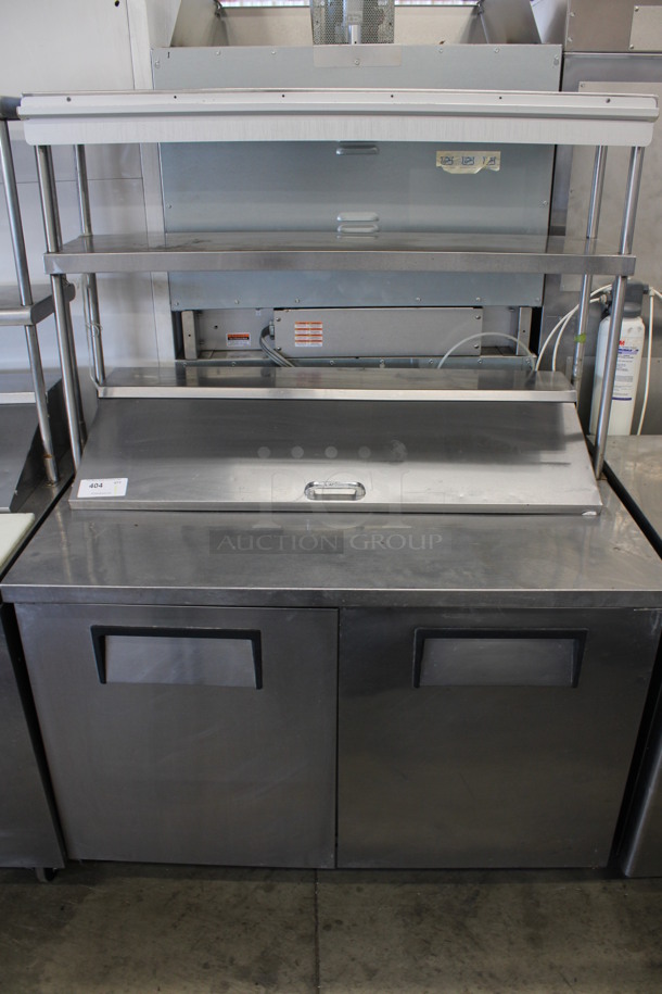 2011 True Model TSSU-48-12 Stainless Steel Commercial Sandwich Salad Prep Table Bain Marie w/ Double Tier Over Shelf on Commercial Casters. 115 Volts, 1 Phase. 48x30x69. Tested and Powers On But Does Not Get Cold