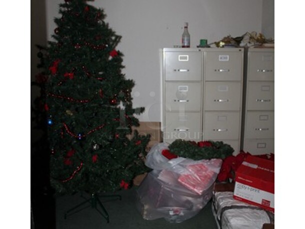 ALL ONE MONEY! Lot includes Fake Holiday Free, Filing Cabinets, and Various Holiday Decorations. Winning Bidder Can Take What They Want From Lot!