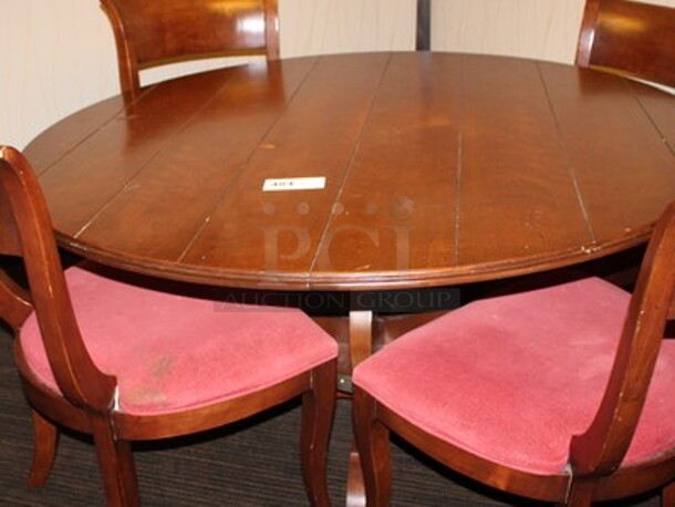 Round Wooden Dining Table with 4 Wooden Chairs! Table is 56x56x29. BUYER MUST REMOVE!