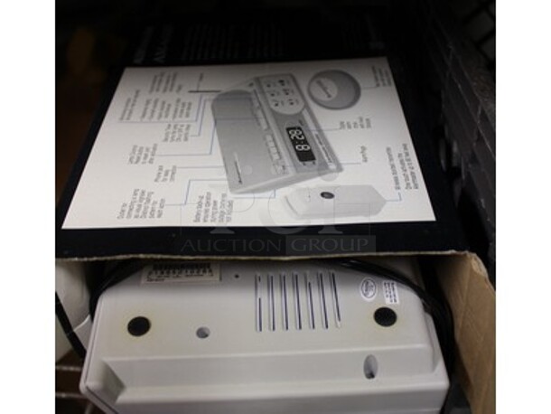 ALL ONE MONEY! Metal Shelving Unit With Paradyne Modems, Brand New Phones, Various Cables, AlertMaster Am-6000 Alarm Clocks, and More! Winning Bidder Can Take What They Want From Lot! - Image 3 of 8