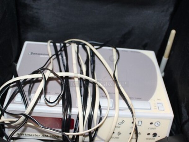 ALL ONE MONEY! Metal Shelving Unit With Paradyne Modems, Brand New Phones, Various Cables, AlertMaster Am-6000 Alarm Clocks, and More! Winning Bidder Can Take What They Want From Lot! - Image 8 of 8