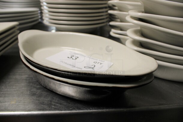 2 White and Black Ceramic Single Serving Casserole Dishes. 10x5x1.5. 2 Times Your Bid! (kitchen) - Image 1 of 3