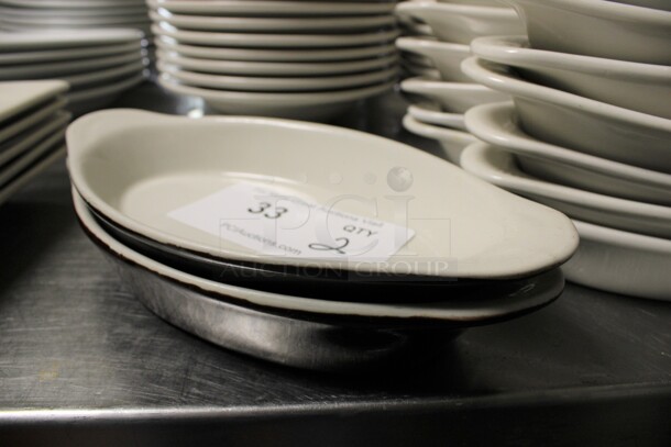 2 White and Black Ceramic Single Serving Casserole Dishes. 10x5x1.5. 2 Times Your Bid! (kitchen)