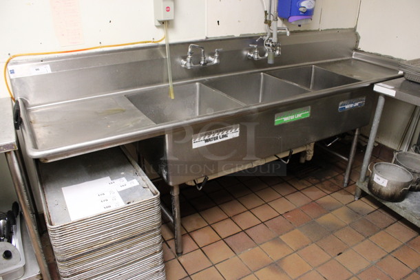 Stainless Steel Commercial 3 Bay Sink w/ Dual Drainboards, Faucet, Handles and Spray Nozzle Attachment. BUYER MUST REMOVE. 108x30x44. Bays 20x24x12. Drainboards 21x26x2. (kitchen) - Image 1 of 4