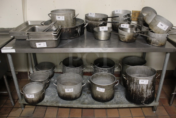 Stainless Steel Commercial Table w/ Under Shelf. Does Not Come w/ Contents. 72x30x35. (kitchen)