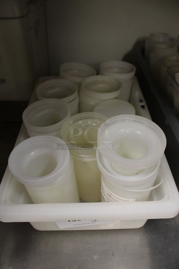 ALL ONE MONEY! Lot of Poly Containers w/ Pourer Attachment in Bin! 3.5x3.5x12. (kitchen) - Image 1 of 2