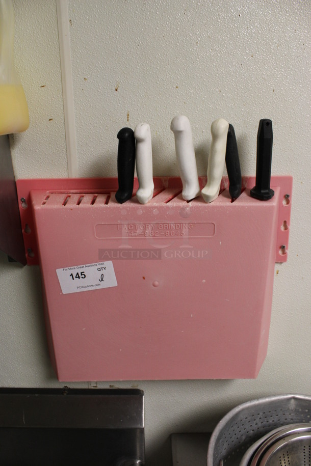 ALL ONE MONEY! Lot of 5 Various Stainless Steel Knives and Knife Sharpening Rod in Red Poly Wall Mount Knife Holder. BUYER MUST REMOVE. 20x3x16. (kitchen) - Image 1 of 6
