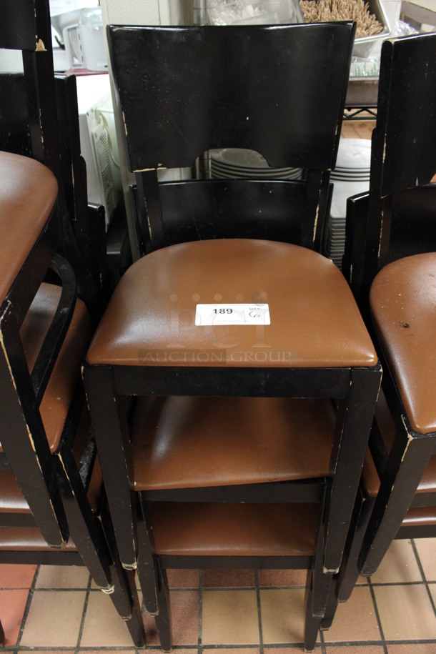 6 Black Wooden Dining Chairs w/ Brown Seat Cushion. Stock Picture - Cosmetic Condition May Vary. 16x16x32. 6 Times Your Bid! (kitchen)