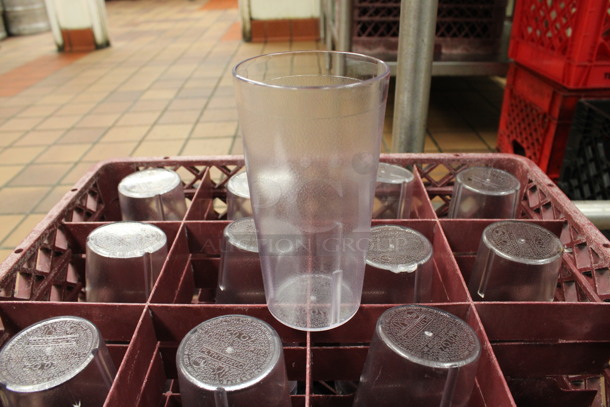 ALL ONE MONEY! Lot of 48 Clear Poly Beverage Tumblers in 2 Red Dish Caddies. 3.5x3.5x6.5. (kitchen)