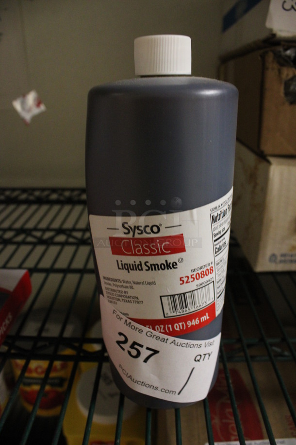 Bottle of Sysco Classic Liquid Smoke. 3x3x9. (kitchen)