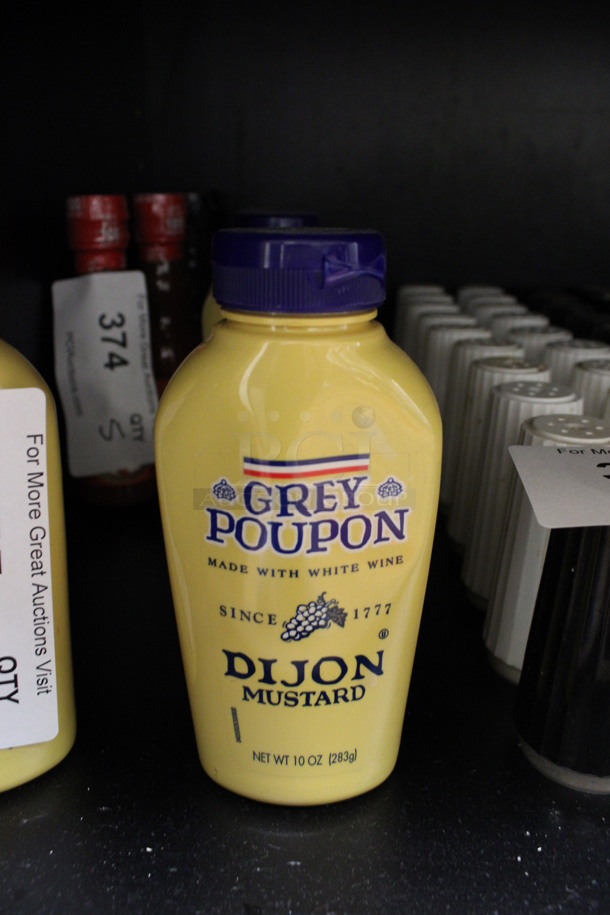 9 Bottles of Grey Poupon Dijon Mustard. 2.5x1.5x6. 9 Times Your Bid! (drink kitchen)