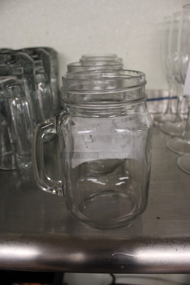 4 Glass Mugs. 4x3x5. 4 Times Your Bid! (drink kitchen)