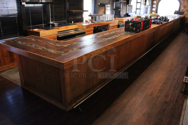 Wooden L Shaped Bar w/ Metal Foot Rail. Contents Are Not Included. BUYER MUST REMOVE. 47'x6'x3.5'. (bar)