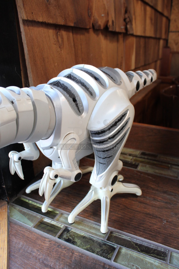 White and Gray Countertop Dinosaur Toy. 8x30x11. (bar) - Image 2 of 4