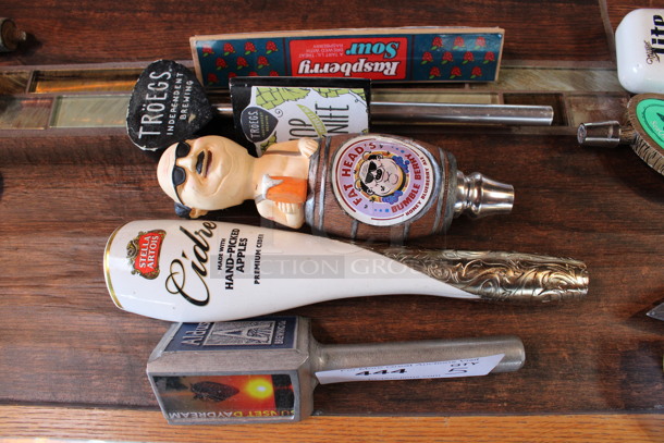 5 Various Beer Tap Handles; Raspberry, Troegs, Fat Head, Stella Artois and Aldus. Includes 8.5