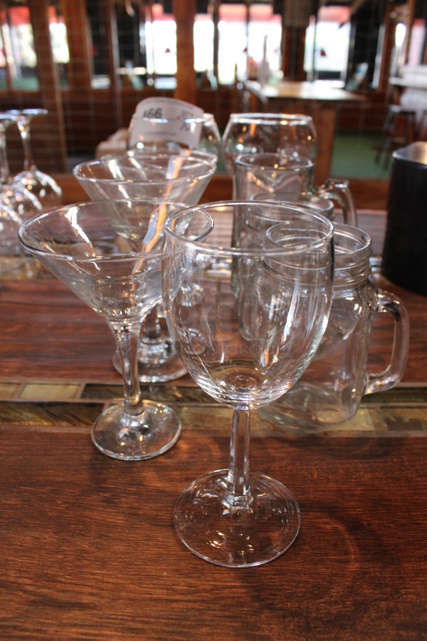 9 Various Glasses; Including Wine Glasses, Martini Glass and Mug. Includes 4x4x6. 9 Times Your Bid! (bar)