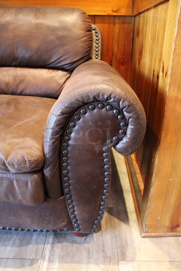 Brown 2 Person Couch w/ Nailhead Trim. 67x38x38. (dining room) - Image 3 of 5