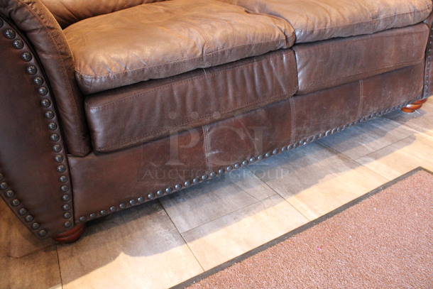 Brown 2 Person Couch w/ Nailhead Trim. 67x38x38. (dining room) - Image 5 of 5