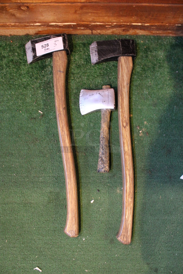 3 Various Fake Axes. 6.5x2x27. 3 Times Your Bid! (dining room)