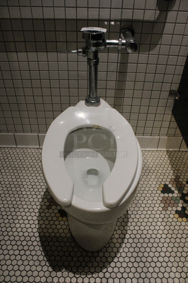 Ceramic Toilet. BUYER MUST REMOVE. 15x26x32. (mens restroom)