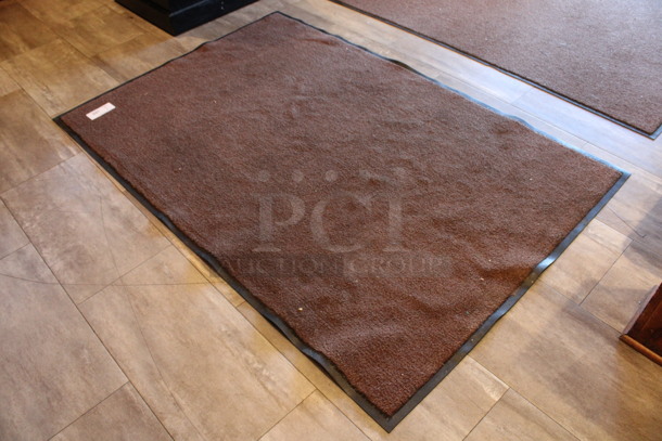 Brown Floor Rug. 67x44. (restroom hallway)
