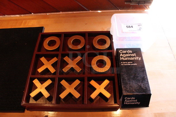 ALL ONE MONEY! Lot of Tic Tac Toe Game, Bar Mat and Cards Against Humanity. (bar on patio) - Image 2 of 5