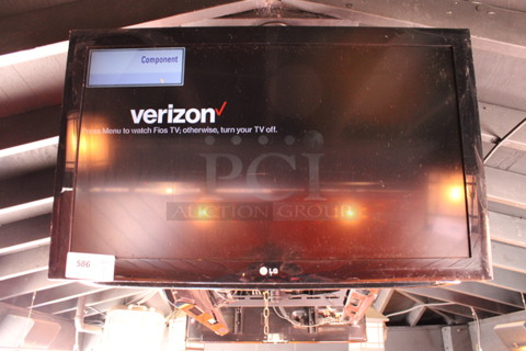 LG 37" Television and TV Mount. Buyer Must Pick Up - We Will Not Ship This Item. Tested and Working! BUYER MUST REMOVE. (bar on patio)