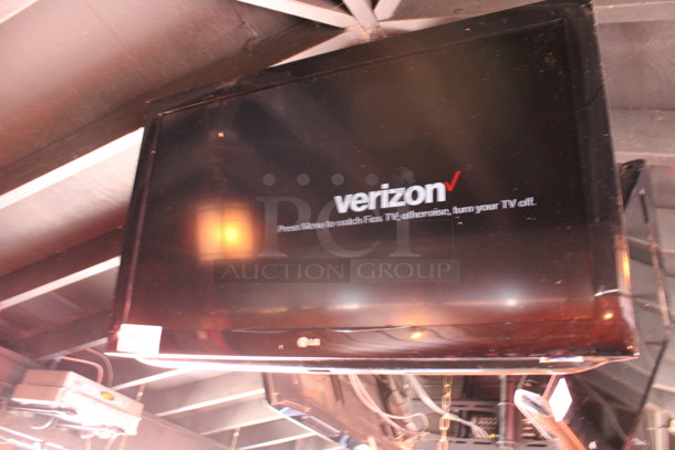 LG 37" Television and TV Mount. Buyer Must Pick Up - We Will Not Ship This Item. Tested and Working! BUYER MUST REMOVE. (bar on patio) - Image 2 of 6
