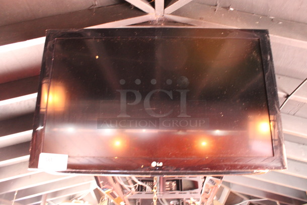 LG 37" Television and TV Mount. Buyer Must Pick Up - We Will Not Ship This Item. Tested and Working! BUYER MUST REMOVE. (bar on patio) - Image 6 of 6