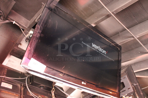 LG 37" Television and TV Mount. Buyer Must Pick Up - We Will Not Ship This Item. Tested and Working! BUYER MUST REMOVE. (bar on patio) - Image 2 of 6