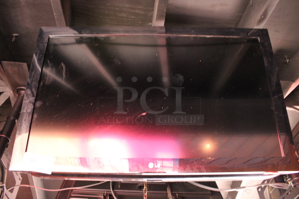 LG 37" Television and TV Mount. Buyer Must Pick Up - We Will Not Ship This Item. Tested and Working! BUYER MUST REMOVE. (bar on patio) - Image 6 of 6