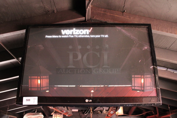 LG 37" Television and TV Mount. Buyer Must Pick Up - We Will Not Ship This Item. Tested and Working! BUYER MUST REMOVE. (bar on patio) - Image 1 of 4