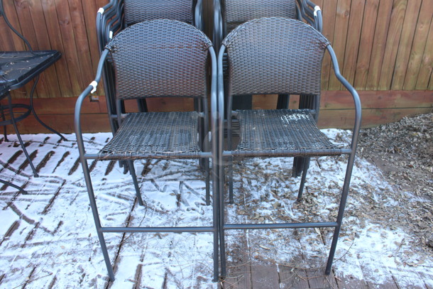 4 Dark Brown Wicker Style Bar Height Chairs w/ Arm Rests. Stock Picture - Cosmetic Condition May Vary. 22x18x45. 4 Times Your Bid! (patio) - Image 1 of 5