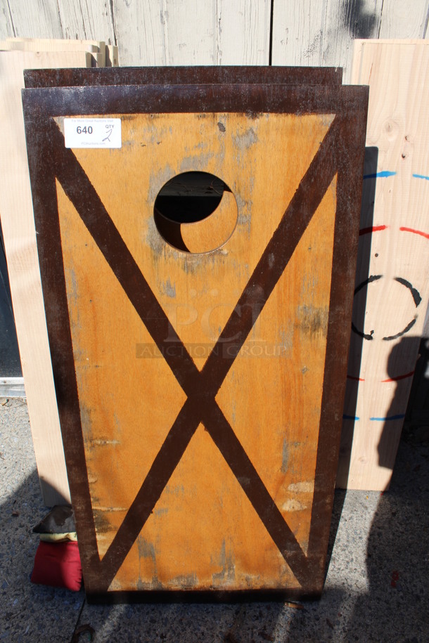 2 Brown Wooden Cornhole Boards w/ 4 Bean Bags. 24x48x4. 2 Times Your Bid! (outside behind kitchen)