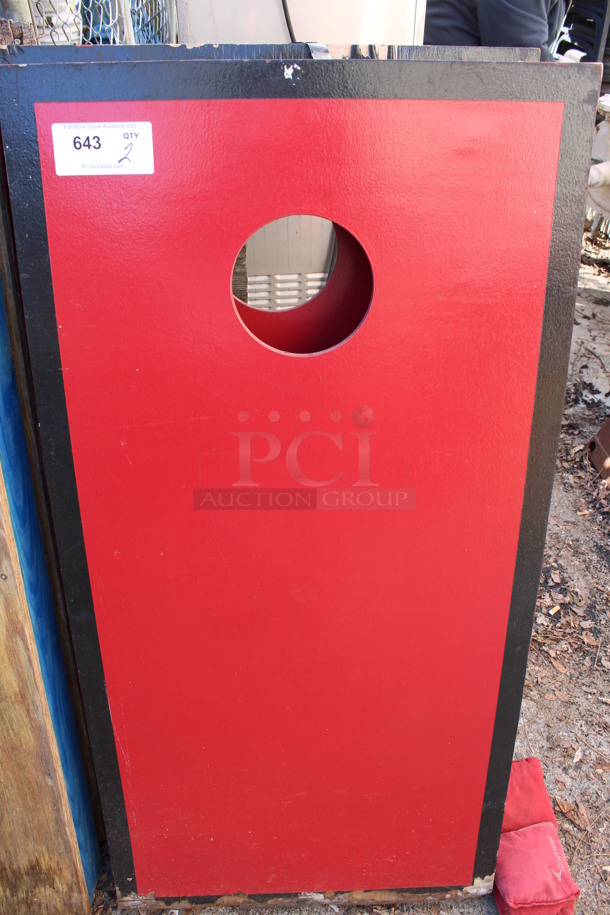 2 Red Wooden Cornhole Boards w/ 4 Bean Bags. 24x48x4. 2 Times Your Bid! (outside behind kitchen)