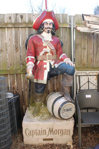 Captain Morgan Floor Style Statue. 37x30x95. (outside behind kitchen)
