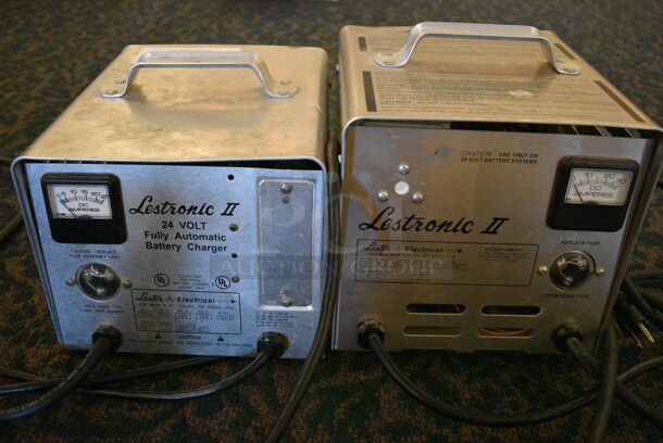 2 Lestronic II 24 Volt Battery Chargers. 9x10.5x9, 9x9.5x10. 2 Times Your Bid! (ballroom)