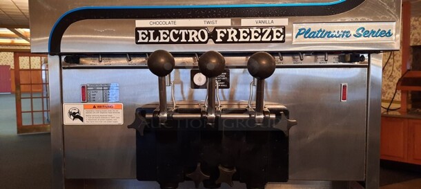 Electro Freeze Model 4000EP-232 Stainless Steel Commercial Air Cooled 2 Flavor w/ Twist Soft Serve Ice Cream Machine w/ Spare Parts on Commercial Casters. 208-230 volts, 3 Phase. 26x39x68.5 (buffet) - Image 4 of 12