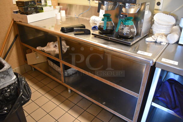 Stainless Steel Commercial Table w/ Under Shelves. Does Not Come w/ Contents. BUYER MUST REMOVE. 80x31x43. (employee breakroom)